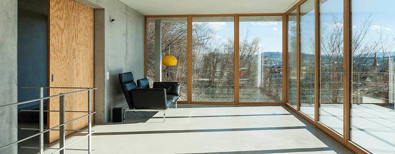 Modernes Traumhaus mit 1a-Aussicht, GIAN SALIS ARCHITEKT GIAN SALIS ARCHITEKT Salas modernas