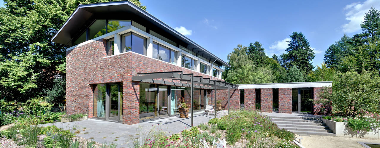 Einfamilienhaus mit schwebendem Dach und Veranda in Bremen, Möhring Architekten Möhring Architekten Casas modernas