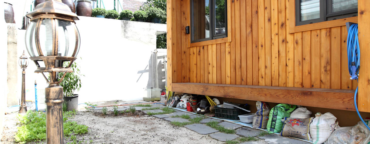도심형 컴팩트하우스 - 단독주택의 새로운 접근법, 주택설계전문 디자인그룹 홈스타일토토 주택설계전문 디자인그룹 홈스타일토토 حديقة