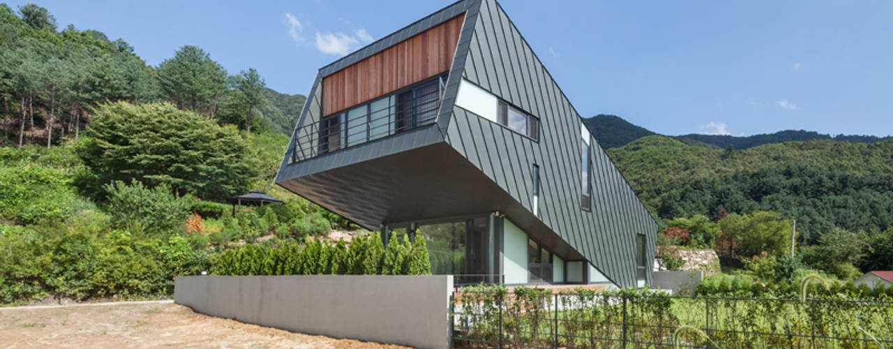 Leaning House, PRAUD PRAUD Casas de estilo moderno