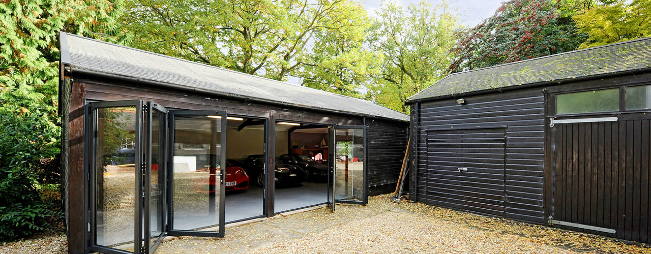 homify Modern garage/shed