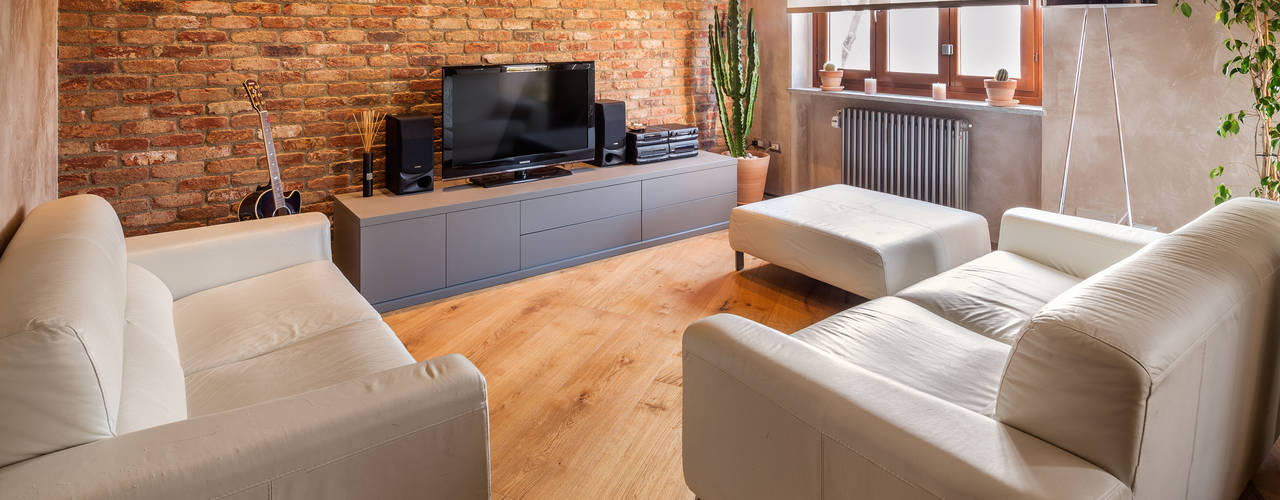 Abbandonare l'impronta tradizionale senza rinunciare ad un ambiente caldo e confortevole, AMlab AMlab Industrial style living room