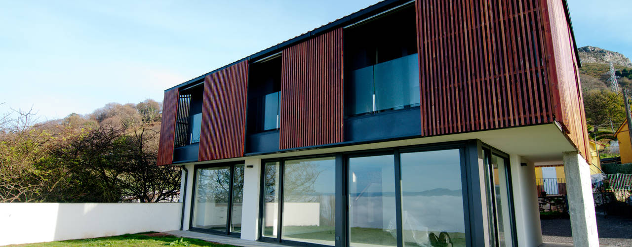 Vivienda en la falda del Naranco, RUBIO · BILBAO ARQUITECTOS RUBIO · BILBAO ARQUITECTOS Houses لکڑی Wood effect