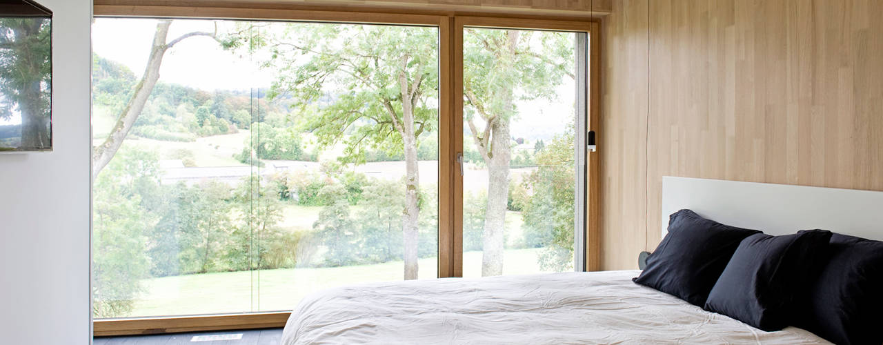 Ökologisches Traumhaus aus Beton und Massivholz, Maisons Loginter Maisons Loginter Bedroom لکڑی Wood effect