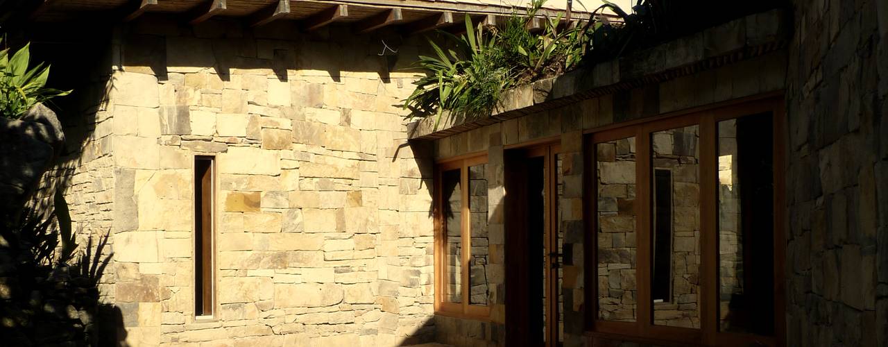 homify Casas de campo Piedra