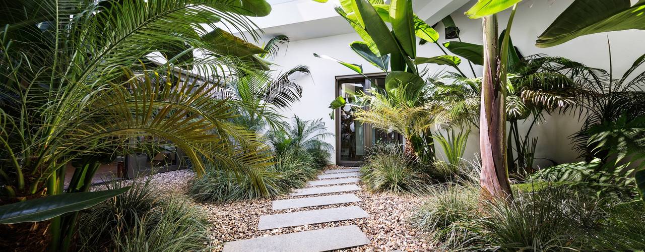 Casa Raio de Luz em Porches, Jardíssimo Jardíssimo Jardines de estilo tropical