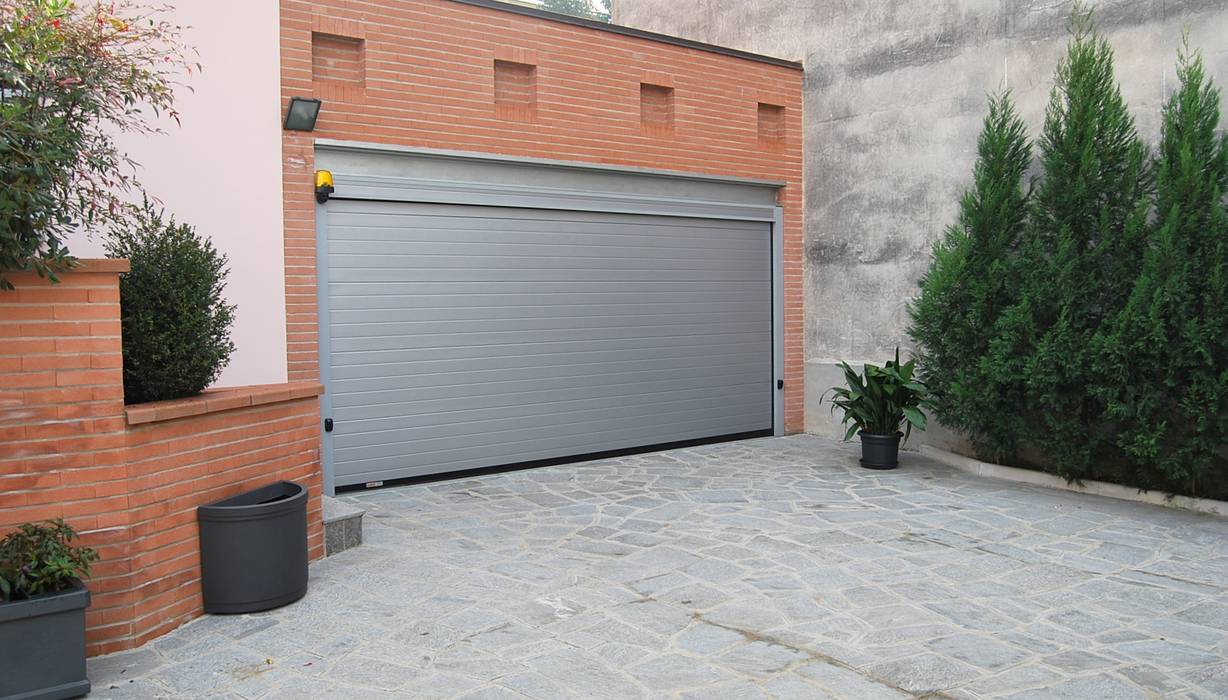 Il garage Studio d'Architettura TAUNISIO Garage/Rimessa in stile moderno Alluminio / Zinco