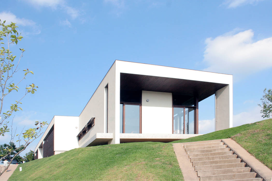 丘の上の二世帯住宅, 時空遊園 JIKOOYOOEN ARCHITCTS 時空遊園 JIKOOYOOEN ARCHITCTS Modern houses