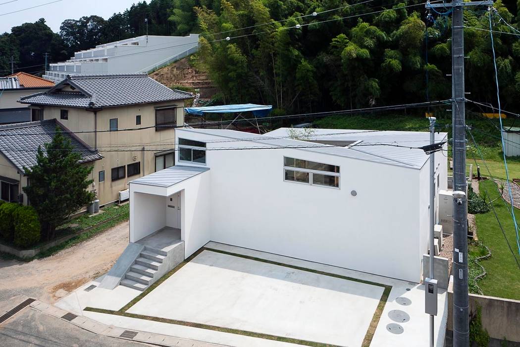 Spiral Roof, 諸江一紀建築設計事務所 諸江一紀建築設計事務所 Дома в эклектичном стиле