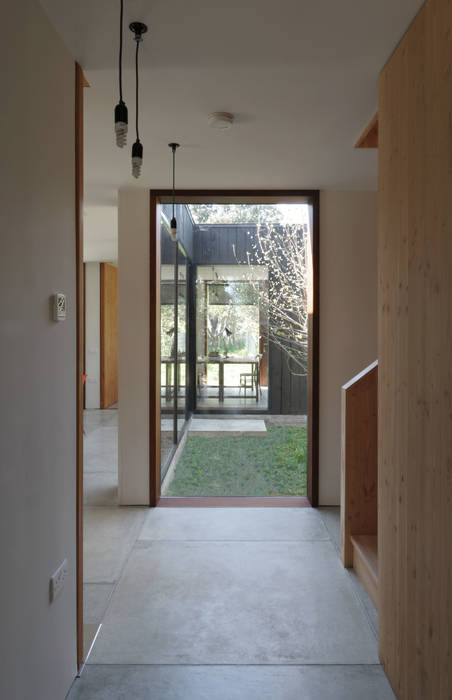 A Timber-Clad House Design on the Isle of Wight: The Sett, Dow Jones Architects Dow Jones Architects Minimalist corridor, hallway & stairs