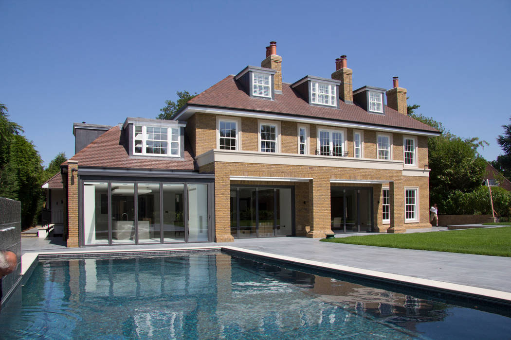 The rear elevation and swimming pool Hale Brown Architects Ltd Country style pool