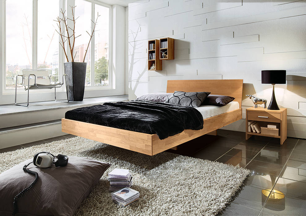 Massivholzbett "Delicia" homify Moderne Schlafzimmer Betten und Kopfteile