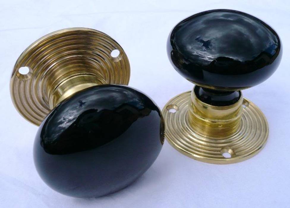 Pair of black glass door knobs on a ribbed brass back plate homify
