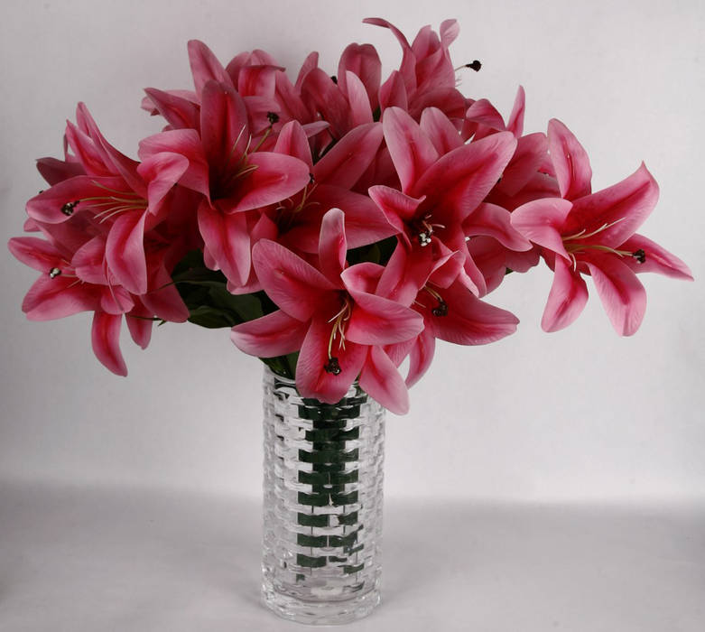 Dark Pink Lily bunches in a glass vase. Uberlyfe Interior garden Interior landscaping