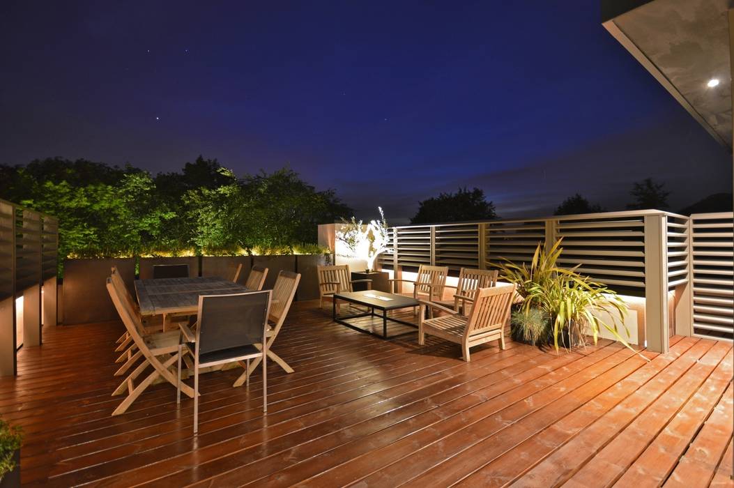 The roof terrace with fire pit table Zodiac Design Modern Terrace