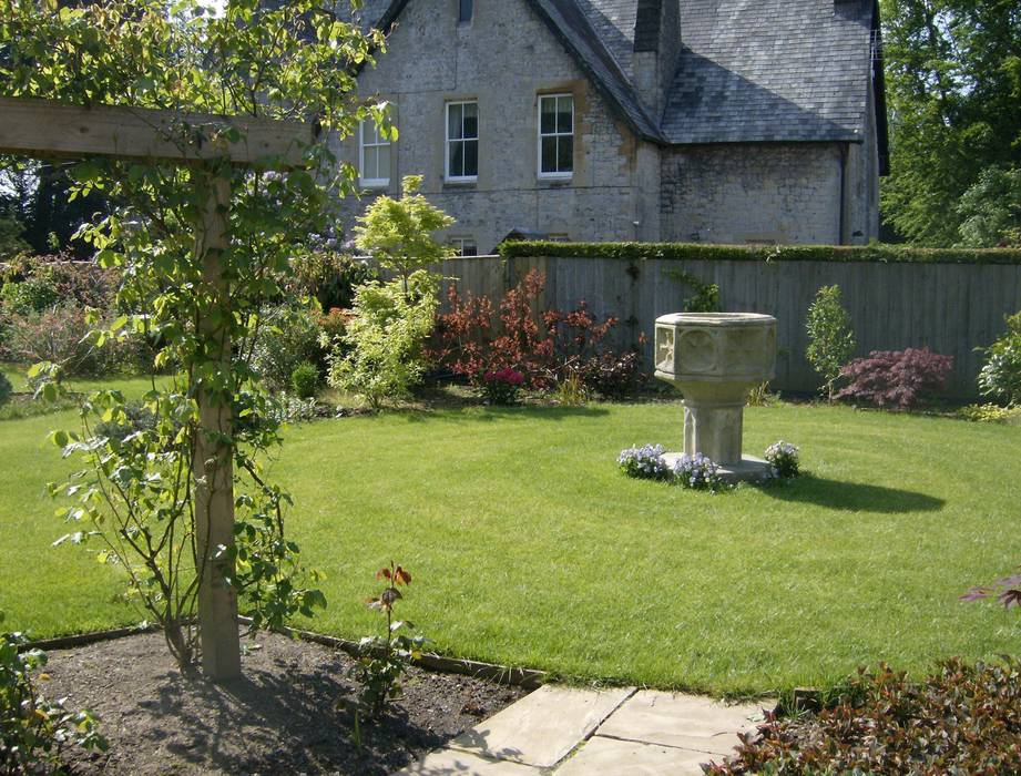 The circular lawn at the end of the garden Christine Wilson Gardens