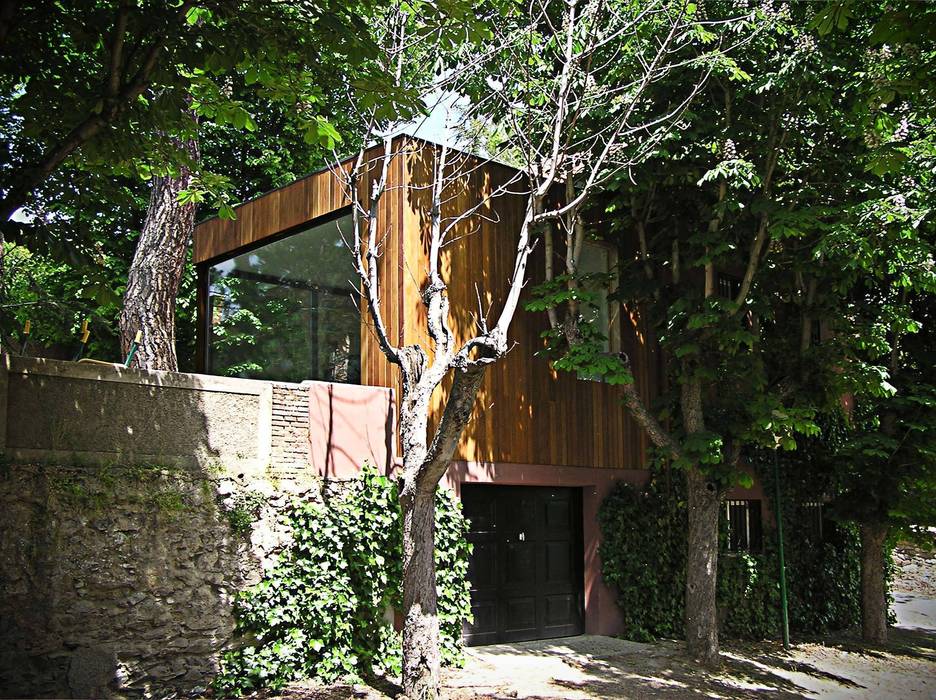 ANTIGUA CASA DE GUARDIA EN UNA COLONIA homify Casas de estilo minimalista