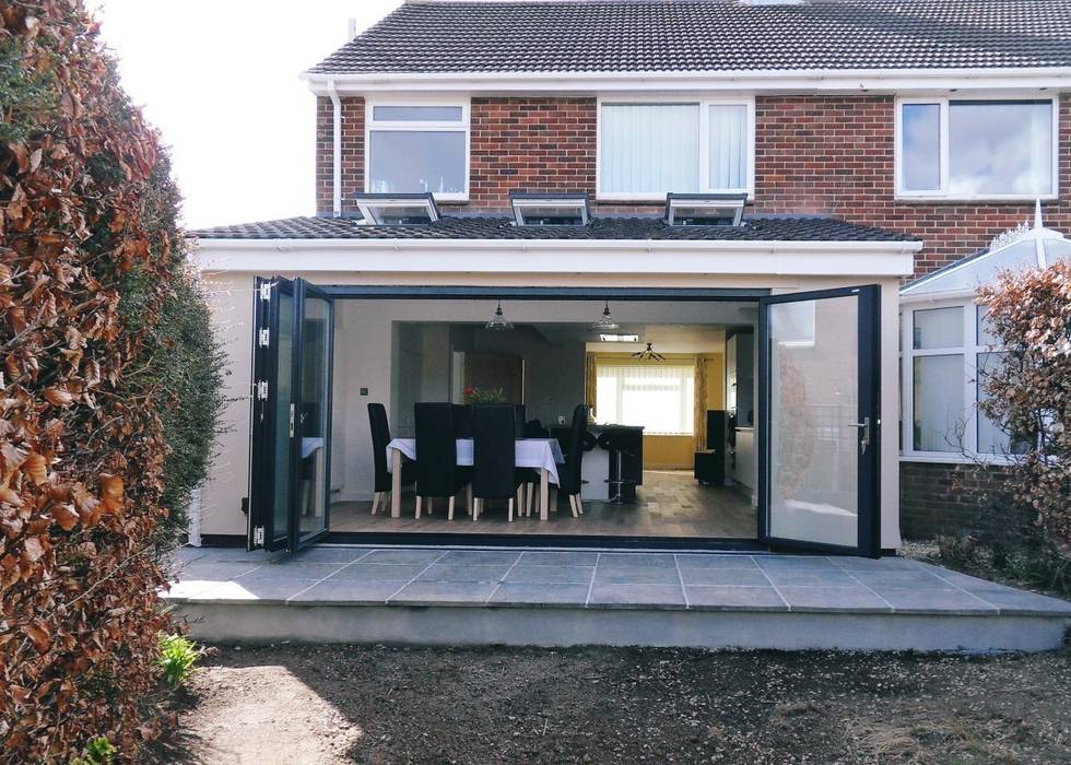 After works - exterior shot with bifold doors open Rogers and Jones Architects Modern houses