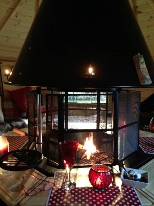 A tall spark guard around this fire. Arctic Cabins Scandinavian style garden