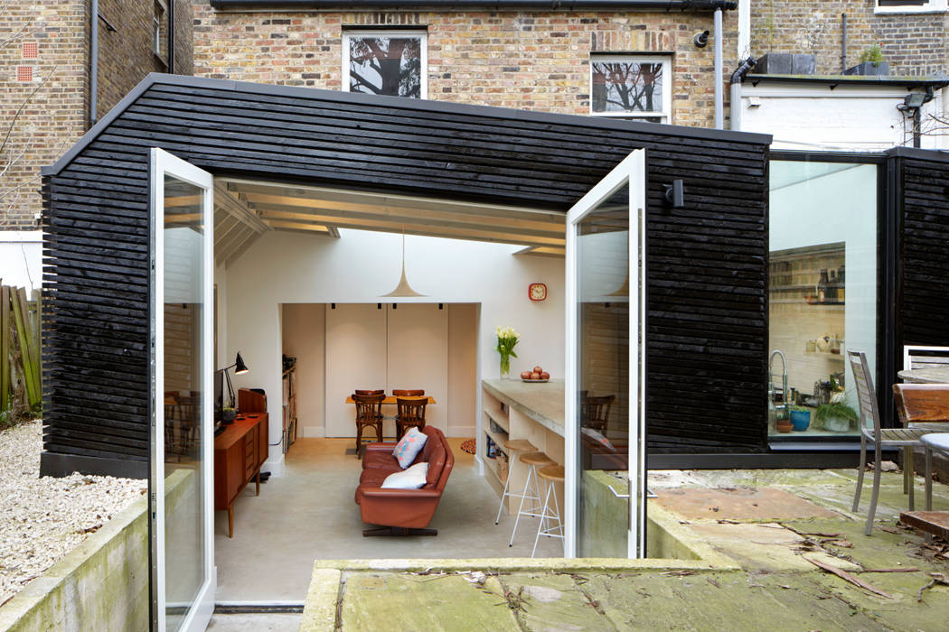 Large external doors to blur the boundaries between outside and inside Fraher and Findlay Living room