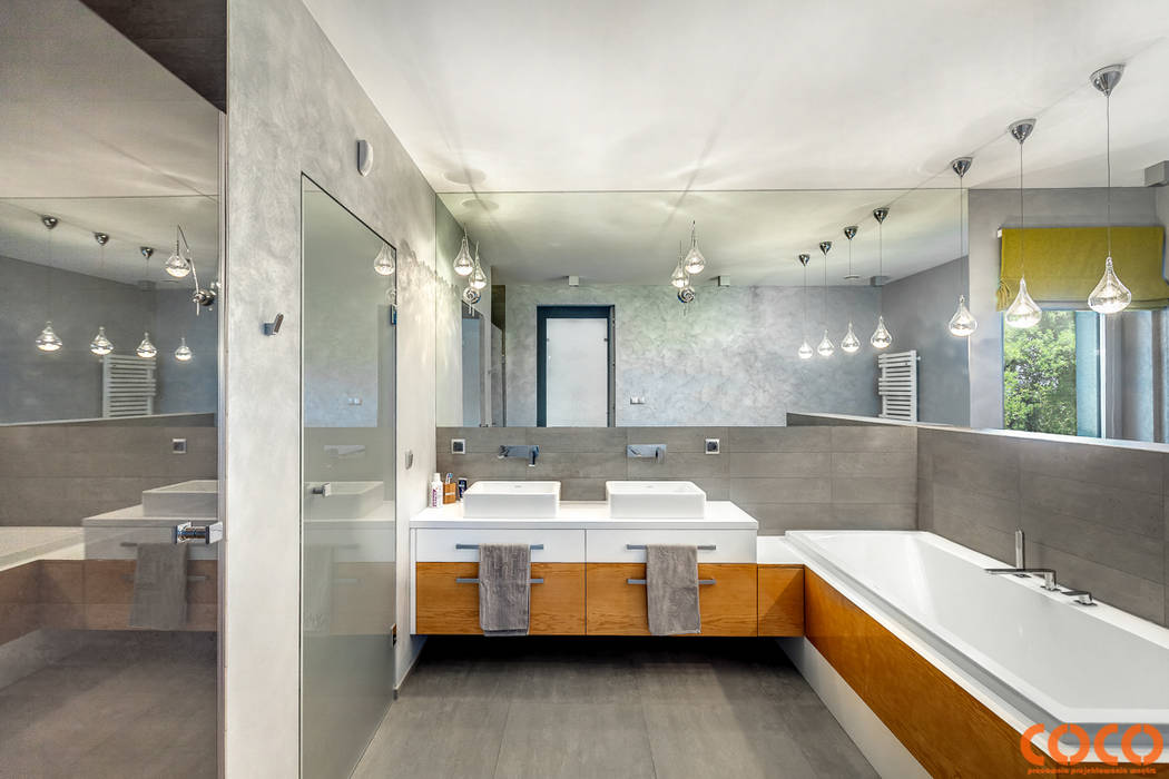 Banheiros minimalistas por COCO Pracownia projektowania wnętrz Minimalista