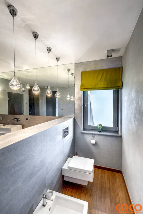 Banheiros minimalistas por COCO Pracownia projektowania wnętrz Minimalista