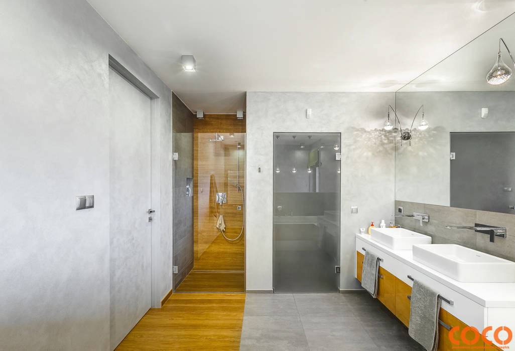 Banheiros minimalistas por COCO Pracownia projektowania wnętrz Minimalista