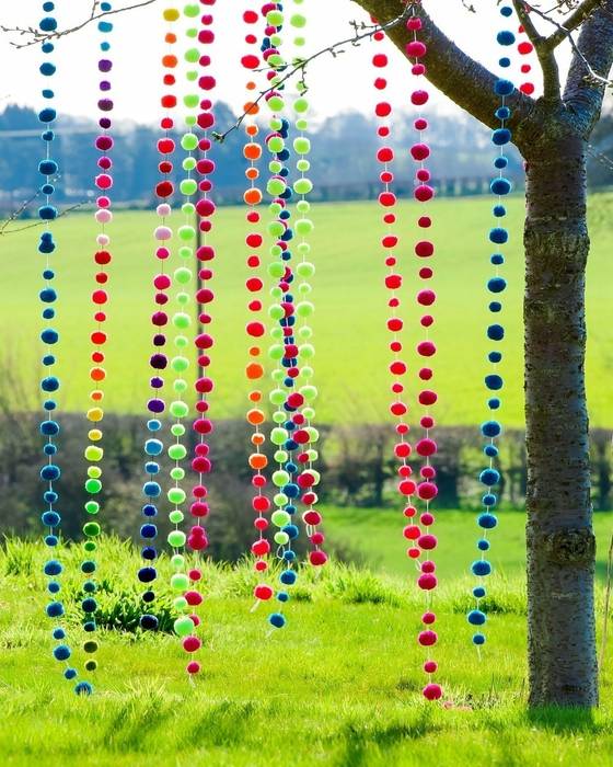 Pom Pom Garlands hanging in the garden PomPom Galore Eclectic style garden