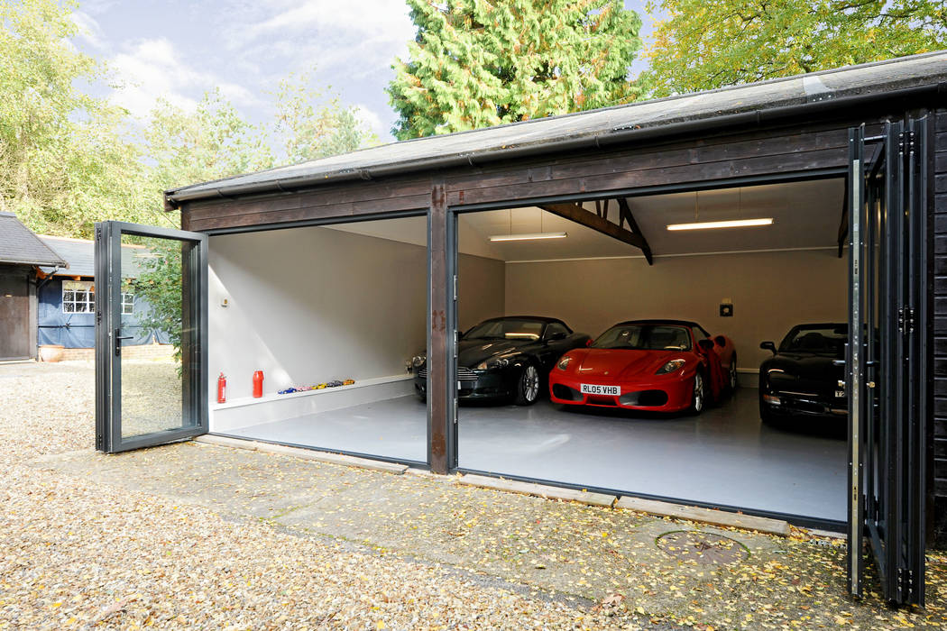 Garage conversion for luxury cars homify Modern Garage and Shed