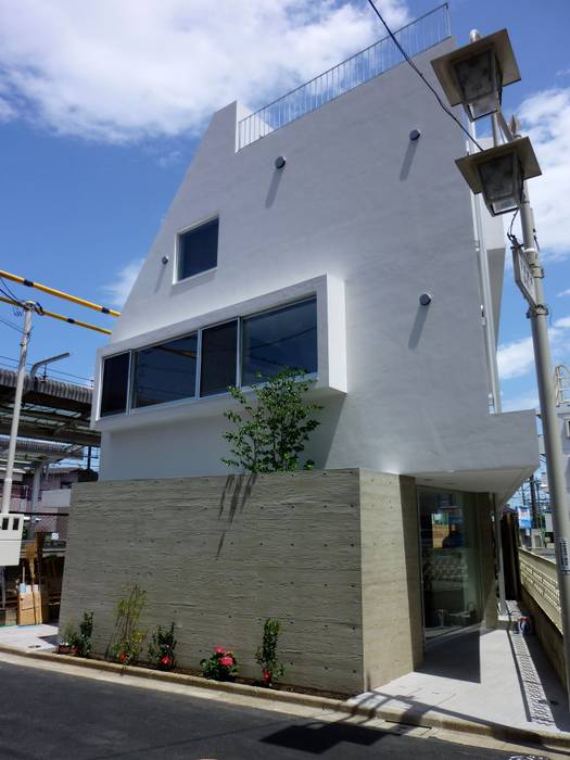 外観 仲摩邦彦建築設計事務所 / Nakama Kunihiko Architects モダンな 家 変形敷地,店舗併用住宅,店舗,二世帯住宅,コンクリート打ち放し,RC,三角形