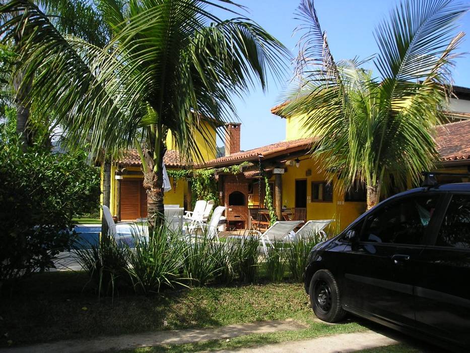 Fachada da casa de veraneio Metamorfose Arquitetura e Urbanismo Casas tropicais