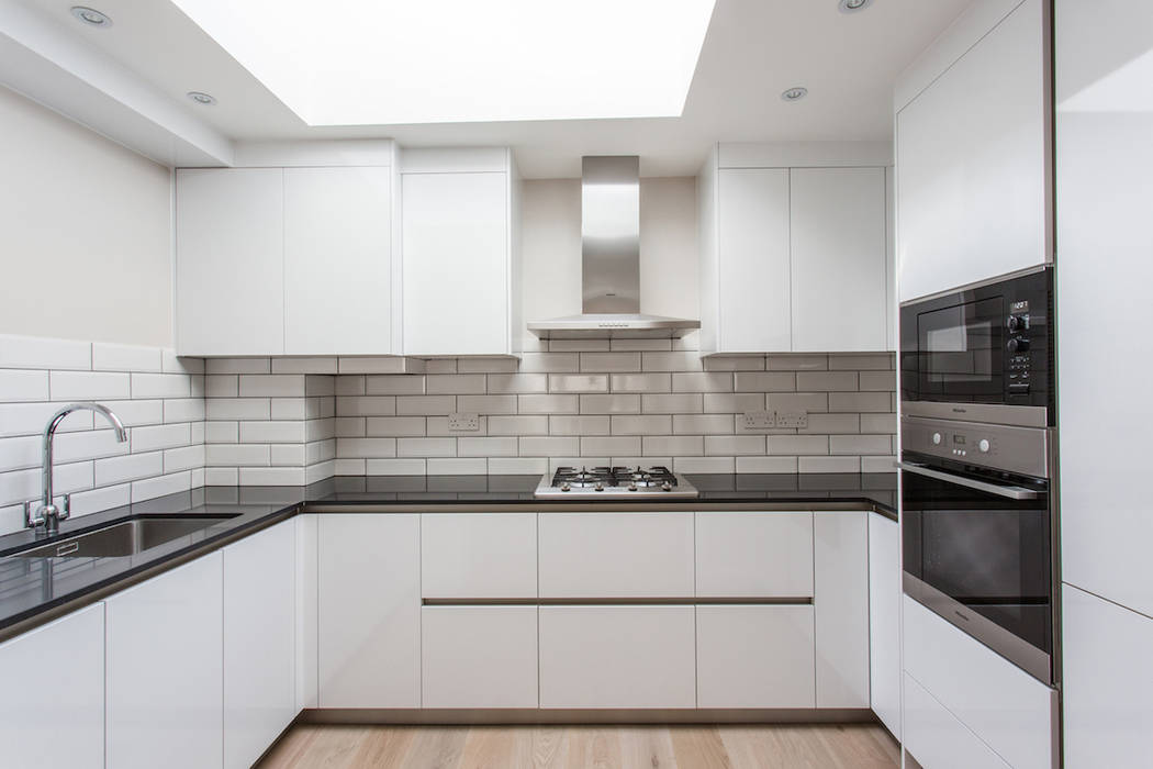 Open plan living, dinning room and kitchen GK Architects Ltd Cocinas de estilo moderno Electrónica