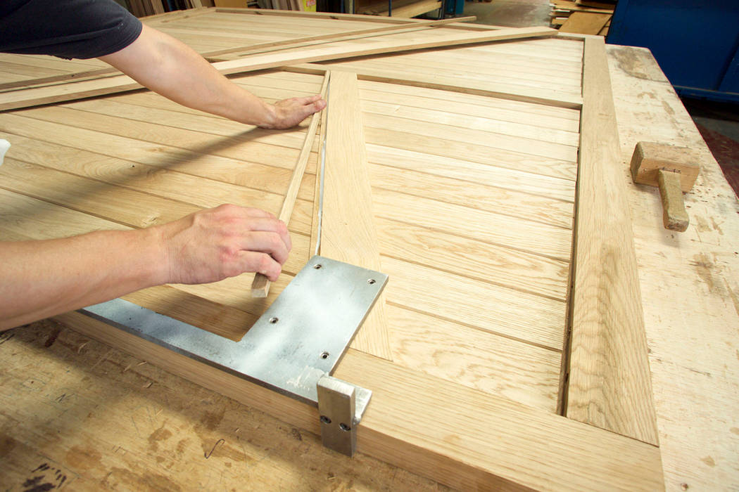 Garage Door being built out of timber The Garage Door Centre Limited Scandinavian style garage/shed Garages & sheds