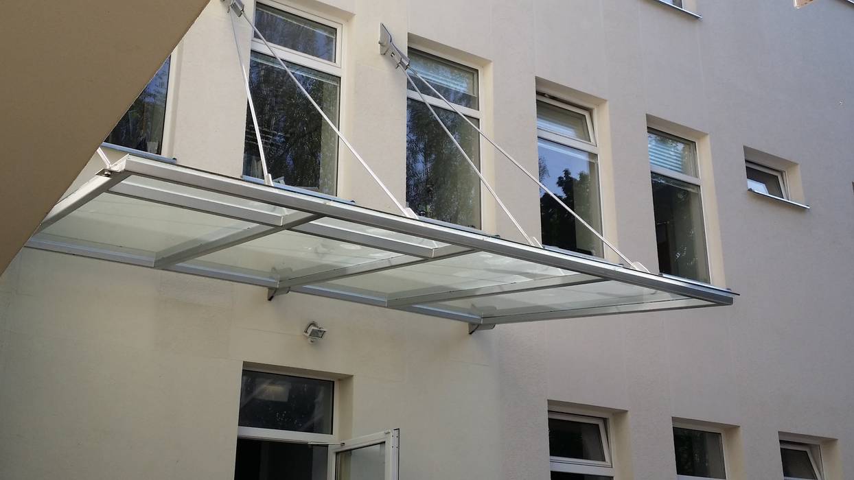 Glass Canopy with wall-suspended supports Inox City Ltd Commercial spaces Schools