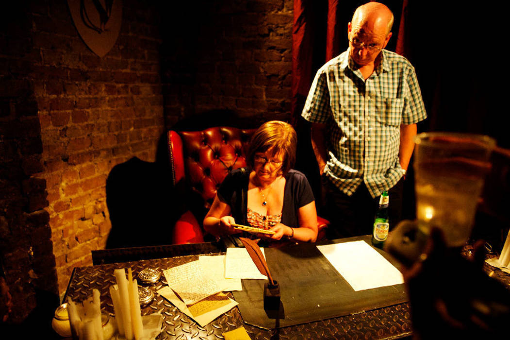 People reading the paperwork in Bonny's desk Traces London Commercial spaces Event venues