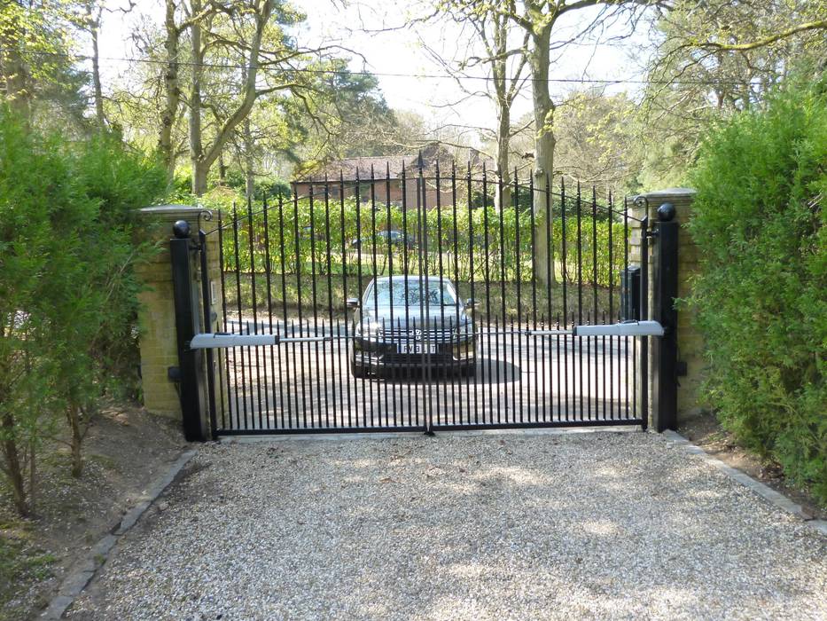 Rear View of Classical style metal electric gates with above ground motors Portcullis Electric Gates Classic style garden