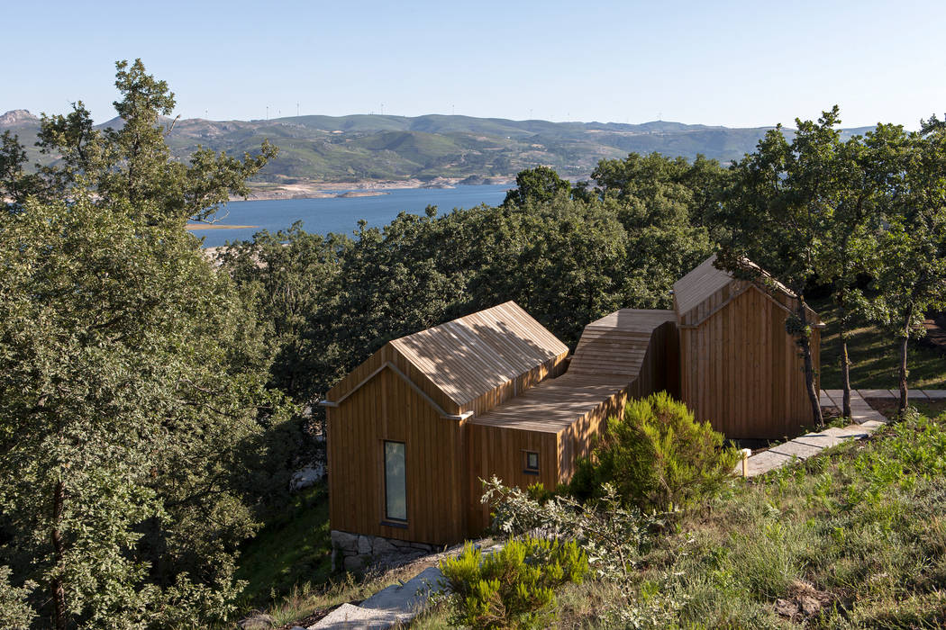 Projekty,  Domy zaprojektowane przez Escritorio de arquitetos
