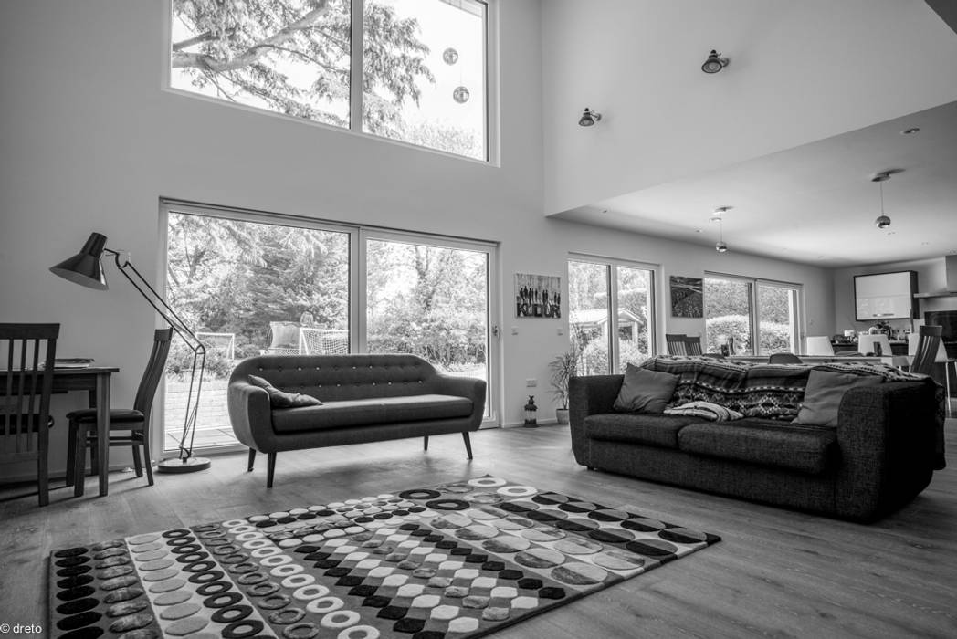 Double height living room The Chase Architecture 모던스타일 거실 가죽 그레이