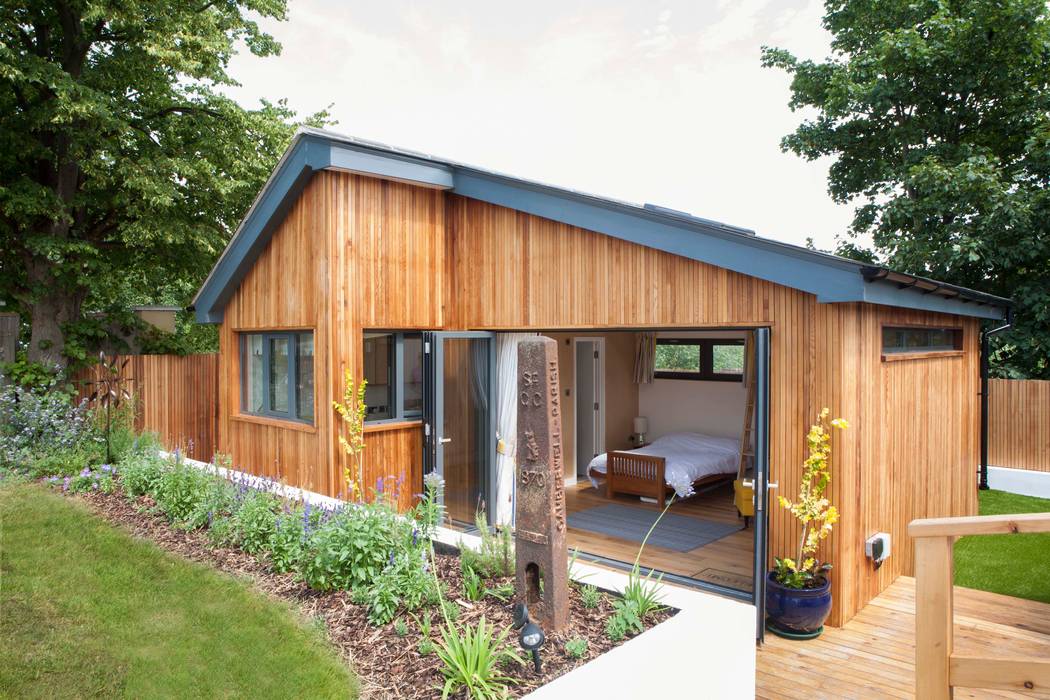 homify Modern garage/shed