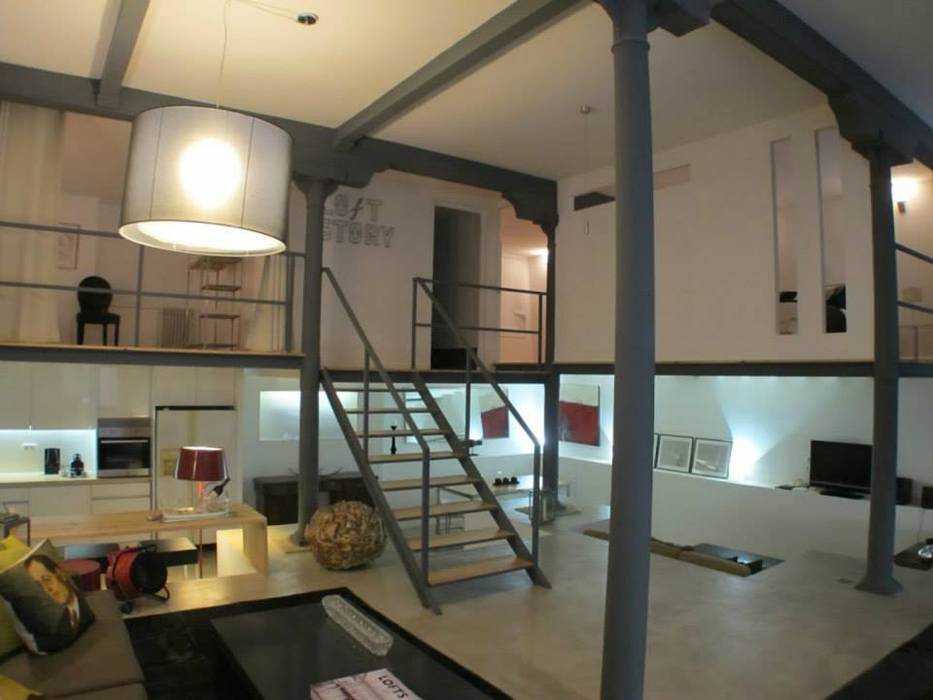 Loft Story, DRCF Arquitectos DRCF Arquitectos غرفة المعيشة