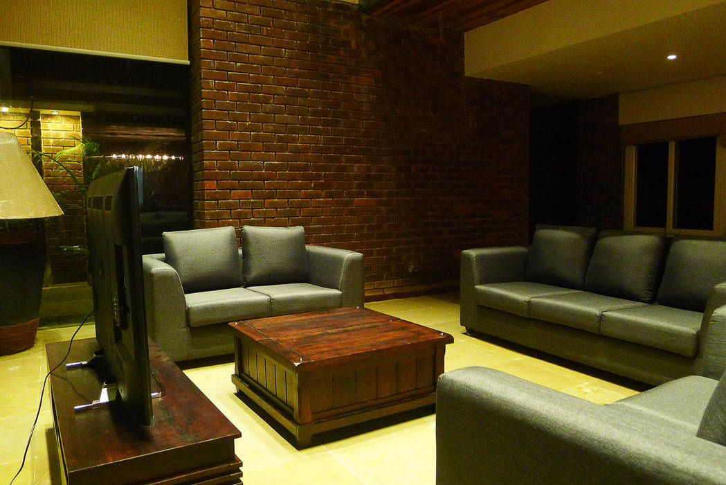 Formal Living space homify Rustic style living room Bricks