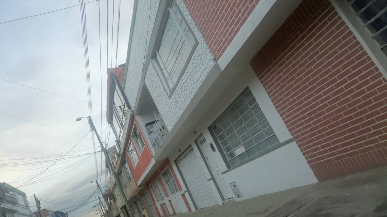 Perspectiva de la fachada principal. MVP arquitectos Balcones y terrazas de estilo minimalista Granito