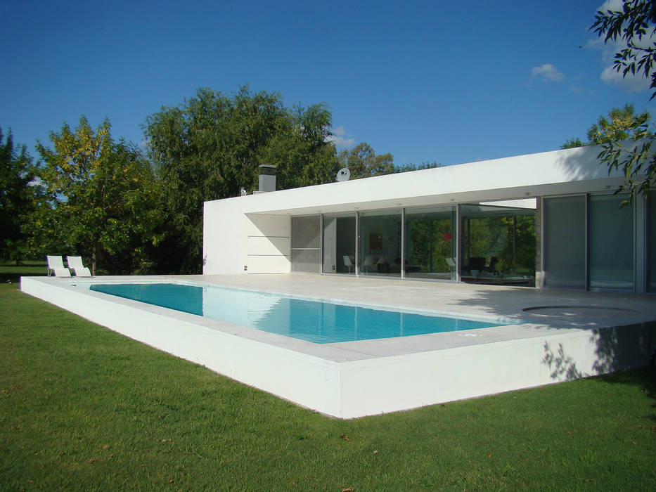 CASA EN OPEN DOOR, MENEGHETTI ARQUITECTOS MENEGHETTI ARQUITECTOS Modern houses