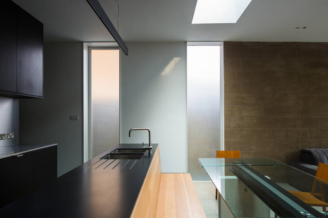 View across kitchen island and built in bench Mustard Architects Industrial style kitchen