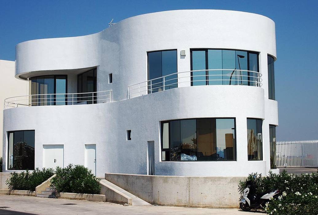 Vista fachada curvas Trencadis Innovacion SL Casas de estilo minimalista Cerámico