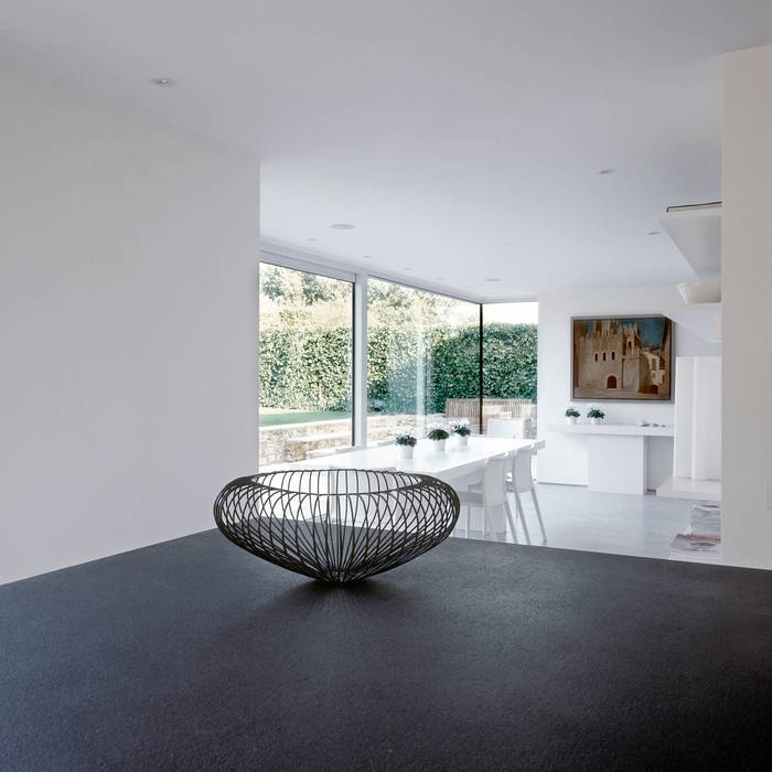 The dining area looking from the kitchen at ​the Old Hall in Suffolk Nash Baker Architects Ltd Moderne eetkamers