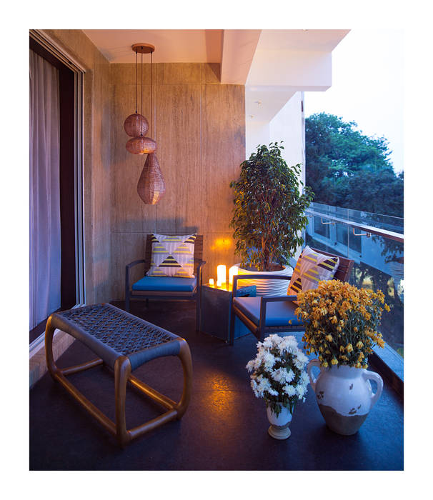 Apartment in Chennai, Rakeshh Jeswaani Interior Architects Rakeshh Jeswaani Interior Architects Eclectic style balcony, veranda & terrace Plant,Flower,Couch,Picture frame,Building,Flowerpot,Table,Azure,Houseplant,Wood