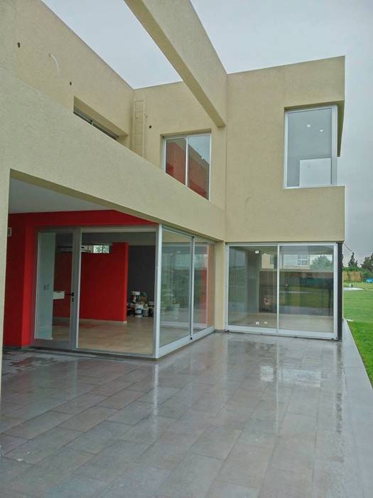 Vivienda unifamiliar_ Barrio Los Troncos, DIMOLAGRILLO ARQUITECTOS DIMOLAGRILLO ARQUITECTOS