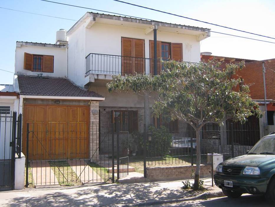 Renovación de fachada - guarda coches, St,ARq. St,ARq.