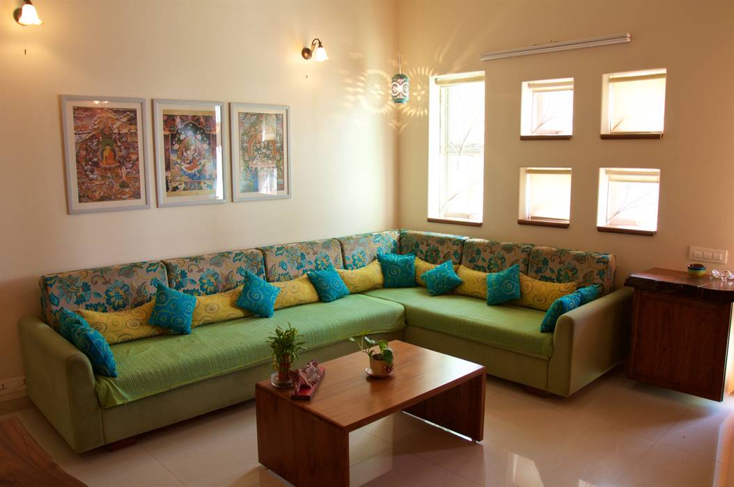 Bungalow in Bhuj, Design Kkarma (India) Design Kkarma (India) Eclectic style living room Couch,Table,Furniture,Property,Green,Azure,Interior design,Lighting,Architecture,Yellow